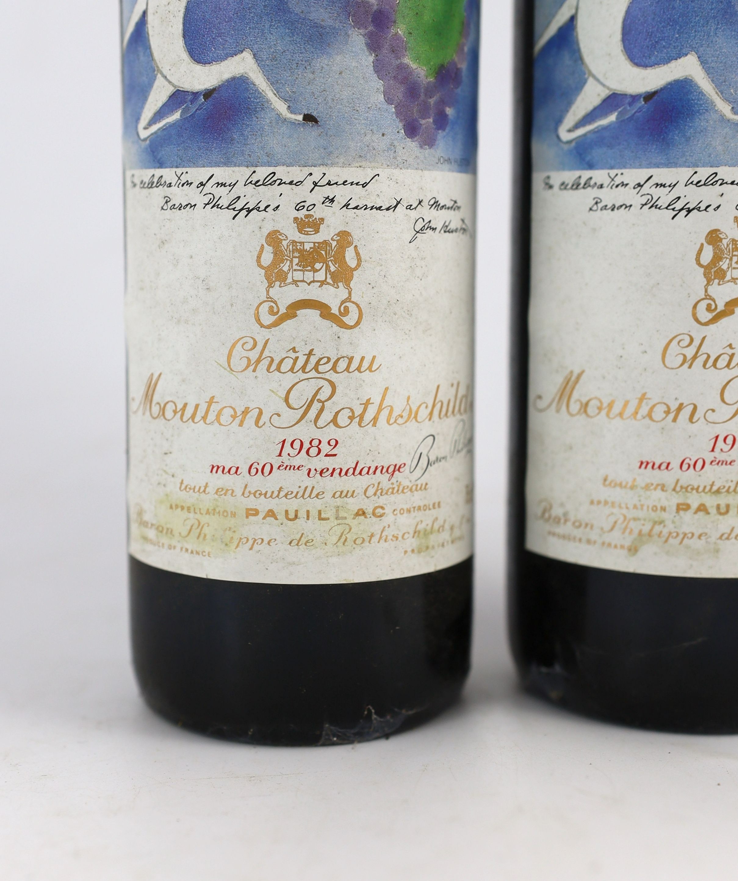 Two bottles of Chateau Mouton Rothschild 1982, height 30cm
